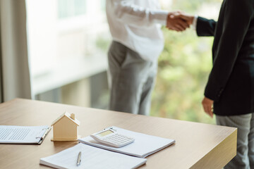 Business people signing contract making deal with real estate agent Concept for consultant home insurance.Real estate investment Property insurance security. Real estate agent offer house