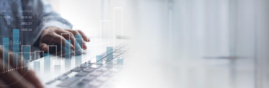 Business, finance and investment concept. Businessman using digital tablet analyzing and calculating financial data with economic graph growth chart, Business strategy and planning. market research