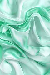 Obraz premium Soft, luxurious textured fabric in a soothing mint green hue, ideal for design and textile backgrounds.