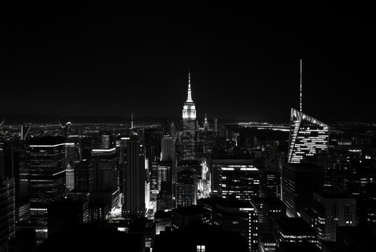 Fototapeta City at Night A black and white photograph of a cityscape at nig