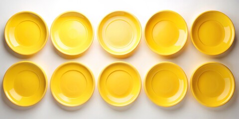 A symmetrical arrangement of ten vibrant yellow circular plates on a pristine white background, creating a minimalist and visually appealing composition.