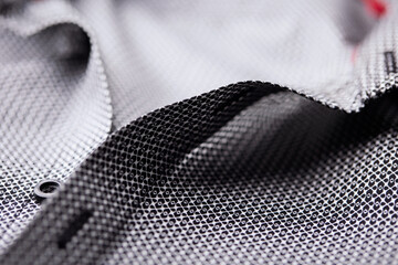 Close up of dark Men's shirt. Soft focus. Copy space.	