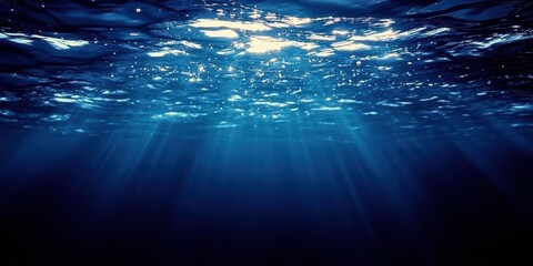 Obraz premium Underwater Light Rays in Deep Blue Ocean