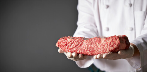 Fresh beef chunks in the chef's hand