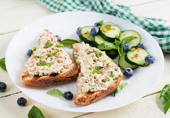 Toasts with tuna. Italian bruschetta sandwiches with pate canned tuna, egg and cucumber.