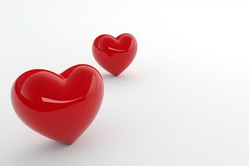 Fototapeta premium Two glossy red hearts floating close to each other, isolated against a plain white backdrop