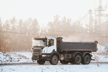 Large Moves Construction Material on Open Highway