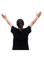 Woman stands with her arms raised in celebration, her ponytail swinging as she smiles in joyful...