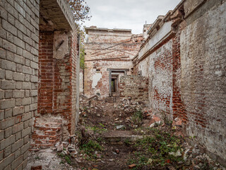 Fototapeta premium Ruins of an old abandoned building. A manor house of the early 19th century.