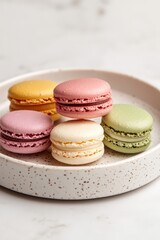 Obraz premium Artful Display of Colorful Floating Macarons on Plate