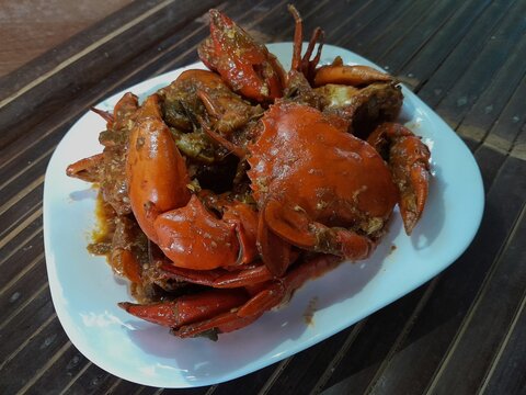 crab oister sauce on white plate