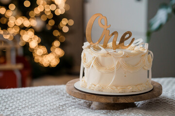 First Birthday Celebration Cake with Elegant Gold Topper and Soft Background