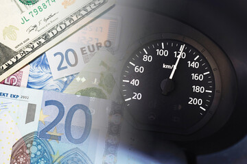 Car speedometer with euro and dollar banknotes in background. Fines for speeding background. High...