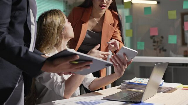 Team of professional business people working with laptops in the office Calculating operating results, summarizing work results, meeting, discussing, analyzing, and solving problems. Teamwork concept.