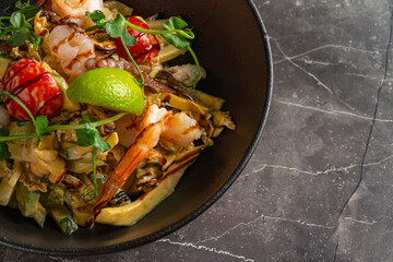 Close up of pasta with seafood and vegetables