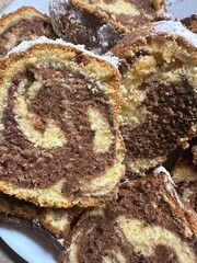 A beautiful kugloff cut into pieces and covered with powdered sugar