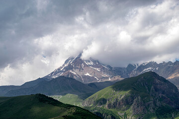 beautiful mountain landscape, clouds cover mountain peaks, Kazbek, Georgia