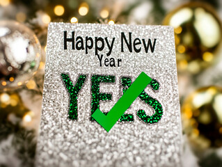 Checklist with "Happy New Year" text, green check mark next to "Yes", conceptual image for design and advertising projects	
