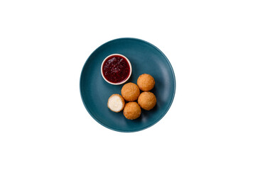 French fries balls with breaded brie or camembert cheese with sweet berry sauce