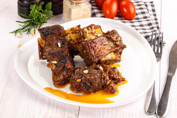 Prepared tasty beef ribs with sauce