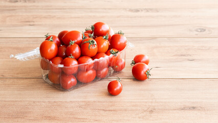 Box of cherry tomatoes. Cherry tomatoes. In a thermo-laminate tray. Packed.