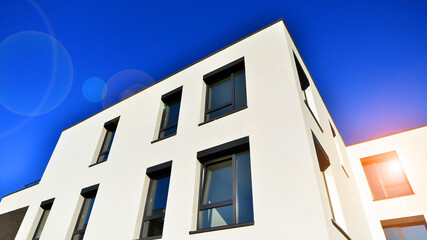 Obraz premium Modern multifamily building in a european city. Walls made of concrete. Luxury house complex.