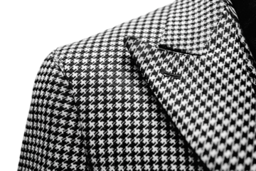 Stylish black and white houndstooth pattern suit jacket isolated on transparent background