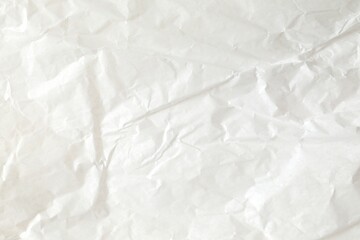 White crumpled paper texture background.
