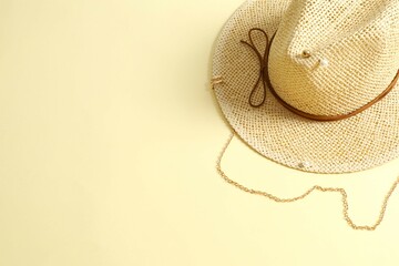 Straw hat on colored background