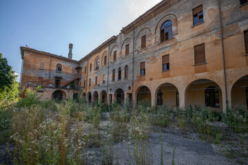 Fototapeta premium Forgotten Building in Northern Italy The Old Abandoned Seminary with a Blue Chapel