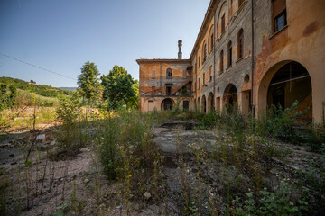Fototapeta premium Forgotten Building in Northern Italy The Old Abandoned Seminary with a Blue Chapel