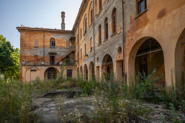 Fototapeta premium Forgotten Building in Northern Italy The Old Abandoned Seminary with a Blue Chapel