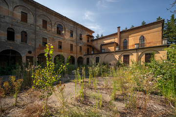 Fototapeta premium Forgotten Building in Northern Italy The Old Abandoned Seminary with a Blue Chapel