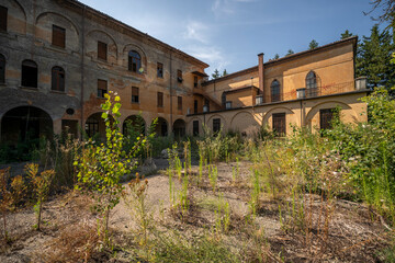 Obraz premium Forgotten Building in Northern Italy The Old Abandoned Seminary with a Blue Chapel