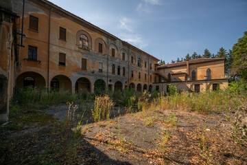 Fototapeta premium Forgotten Building in Northern Italy The Old Abandoned Seminary with a Blue Chapel