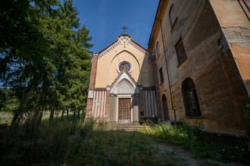 Fototapeta premium Forgotten Building in Northern Italy The Old Abandoned Seminary with a Blue Chapel