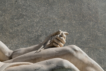 hands holding the ears of corn or wheat, marble hands of the fountain - sculpture for the po river in turin in piazza cnl. water source of life for the world and humanity.