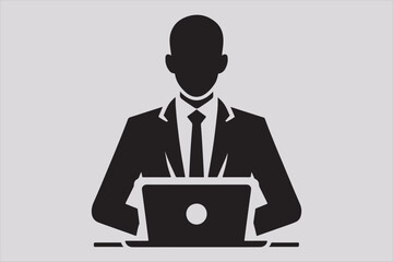 Silhouette of a person sitting behind a laptop.