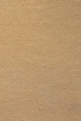 Coarse 80 grit grained sandpaper background backdrop. Woodwork do it yourself materials concept.