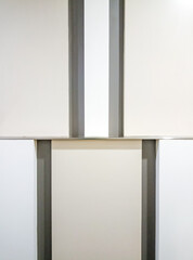 Minimal image, background from a wall with alternating color patterns, contrasting with simple but beautiful shadows.