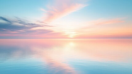 Fototapeta premium A serene sky over calm water at dawn, with soft pink and blue hues reflecting on the glass-like surface of the lake