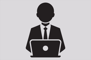 Silhouette of a person sitting behind a laptop.