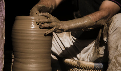 A potter keeping alive the ancient tradition of making pots or pottery using his bare hands. Pottery sculpting is one the many ancient dying industries and need help. It is 100% environmental friendly