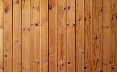 Wooden background, beautiful clean even wood structure. Texture of wooden planks with vertical stripes, waves, age rings, knots