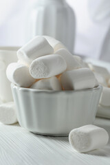 White marshmallows on a wooden table.