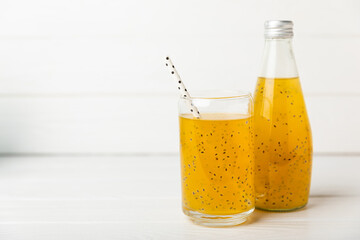 Diet detox cocktail with basil and chia seeds in a glass jar and a glass on a textured background. Drink with seeds. Health food. Detox cocktail. Antioxidant. Water with basil. Space for text. 