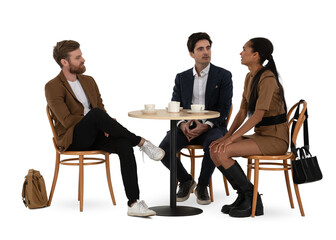 Group of three people sitting in a café and drinking coffee and talking isolated on white...