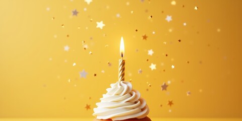 A delightful cupcake topped with creamy frosting and a glowing candle, set against a joyful yellow background with sparkling stars, perfect for celebrations and party themes.