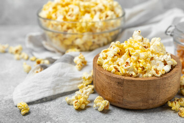 Salty popcorn on bright color background. Cinema and entertainment concept. Movie night with popcorn. Delicious appetizer, snack.Space for text, copy space. Banner
