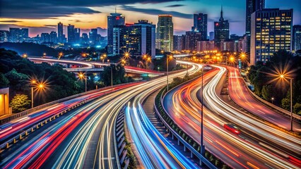 Fototapeta premium Nighttime Highway Light Trails - Silhouette Photography of Busy Traffic Flowing Through Urban Landscape